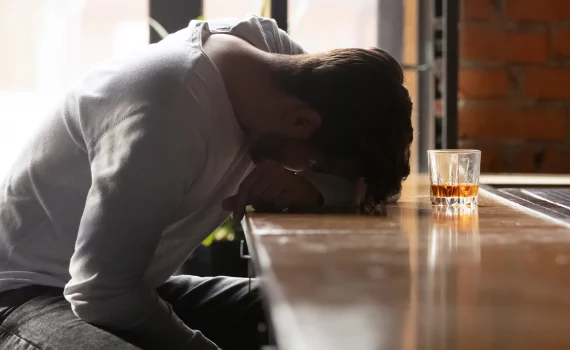 men struggling with alcohol addiction