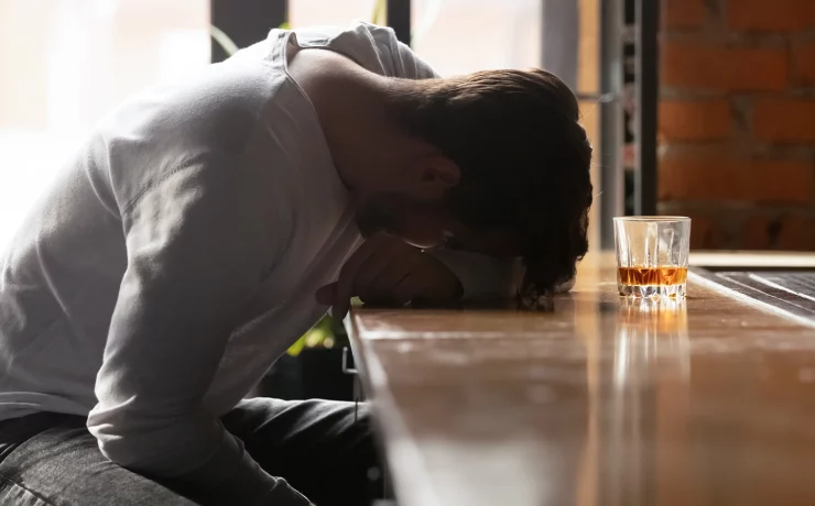 men struggling with alcohol addiction