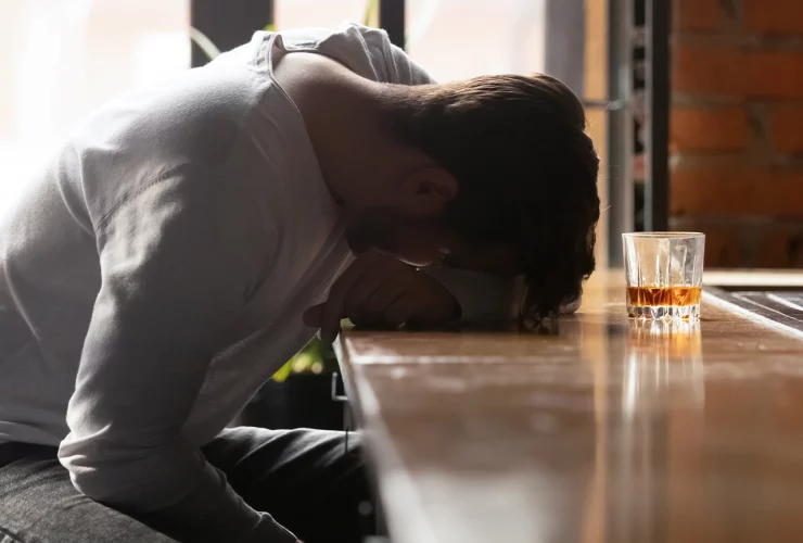 men struggling with alcohol addiction