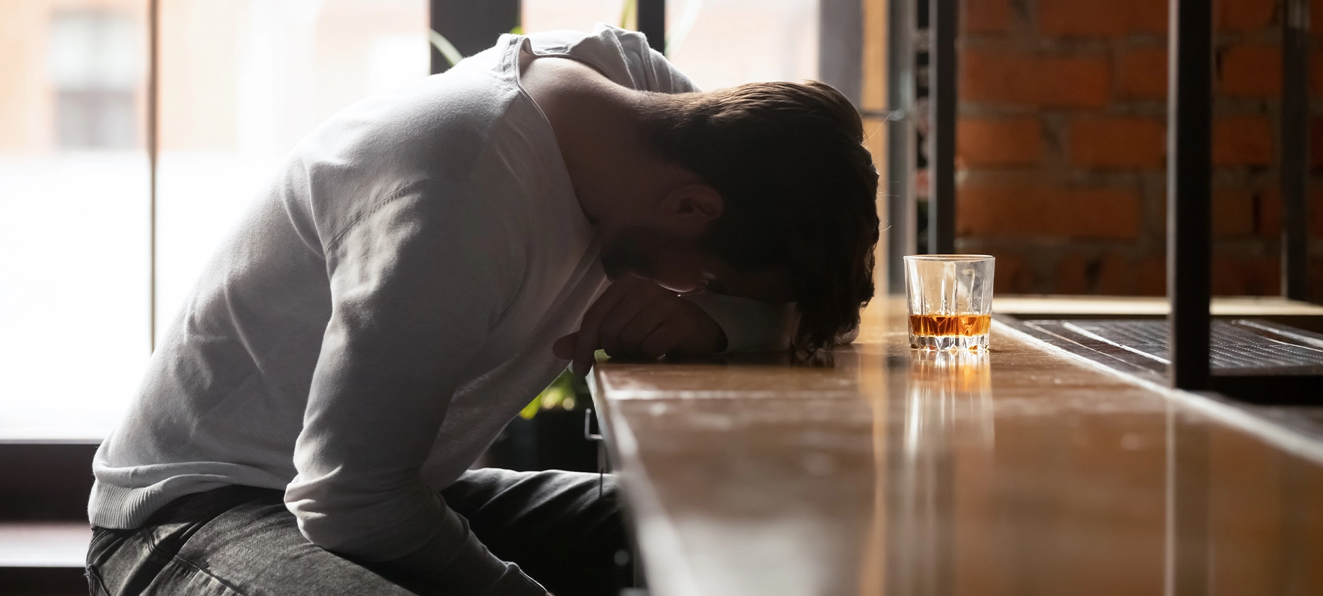 men struggling with alcohol addiction